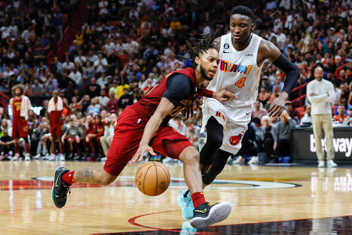Mar 8, 2023; Miami, Florida, USA; Cleveland Cavaliers guard Darius Garland (10) drives to the basket as Miami Heat guard Victor Oladipo (4) defends during the fourth quarter at Miami-Dade Arena.